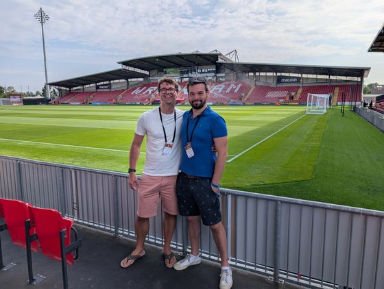 Standing pitchside at Wrexham, the empty stand behind