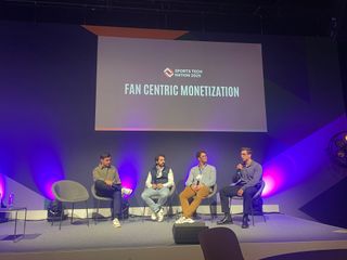 The fan-centric monetisation panel seen from the side of the auditorium, the screen lit behind them