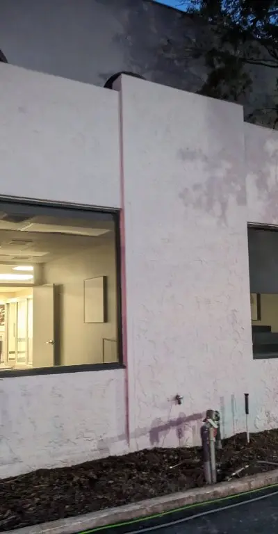 Commercial building stucco cleaning before