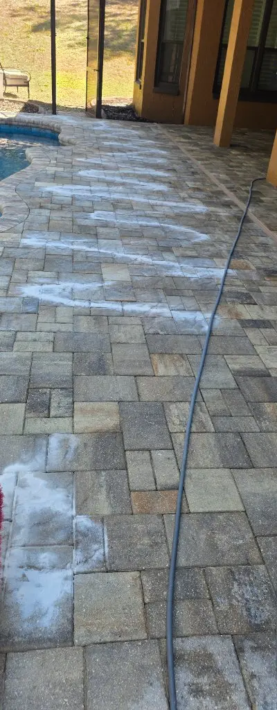 Pool deck cleaning in progress