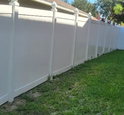 Long vinyl fence after pressure washing Central Florida