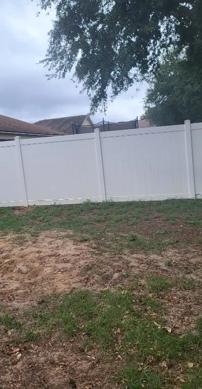 Vinyl fence after cleaning bright white
